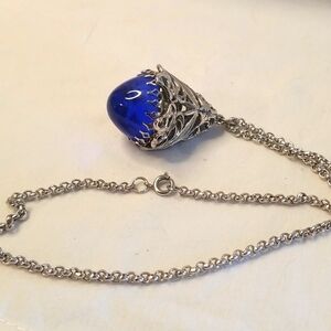 Silver metal with blue oracle